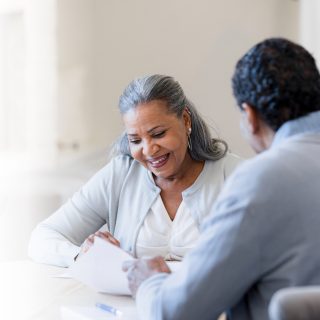 Woman Talking With Financial Advisor