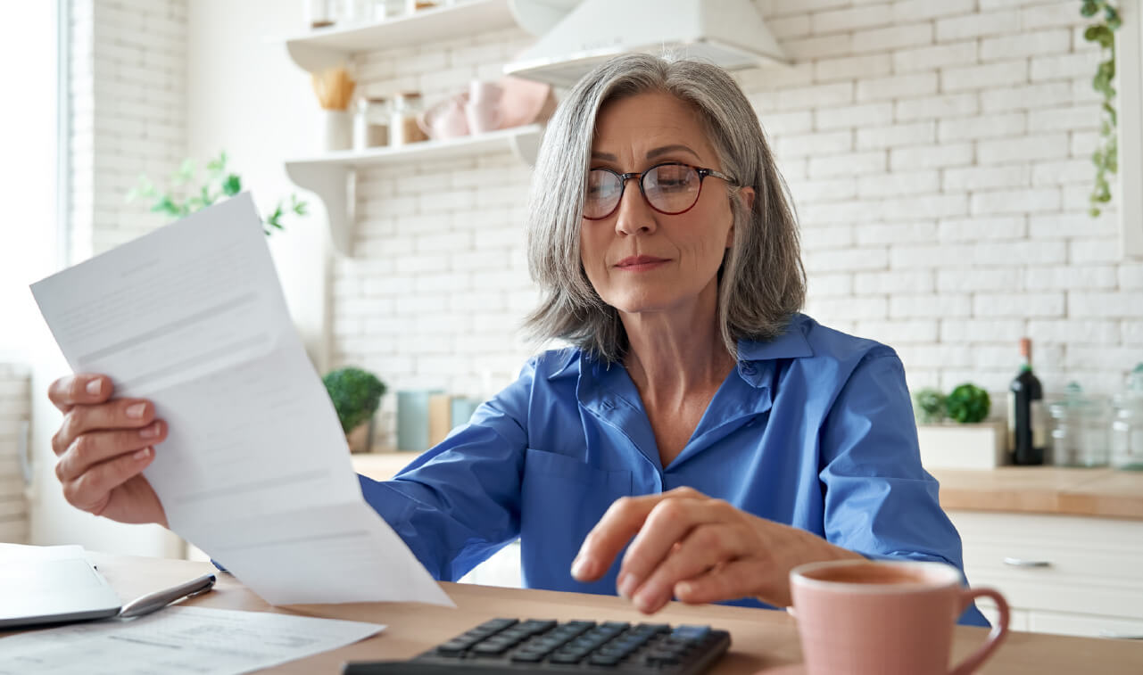 Woman looking over financial statement